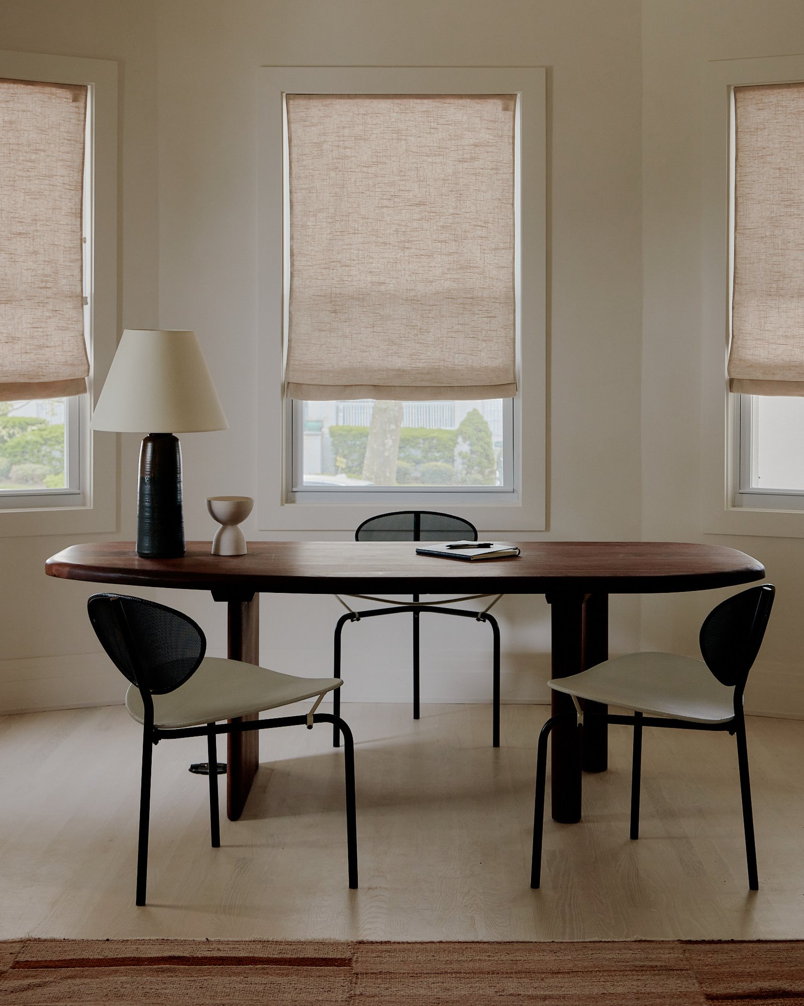 Corporate retreat meeting setup in the dining room with clean, minimalist styling.